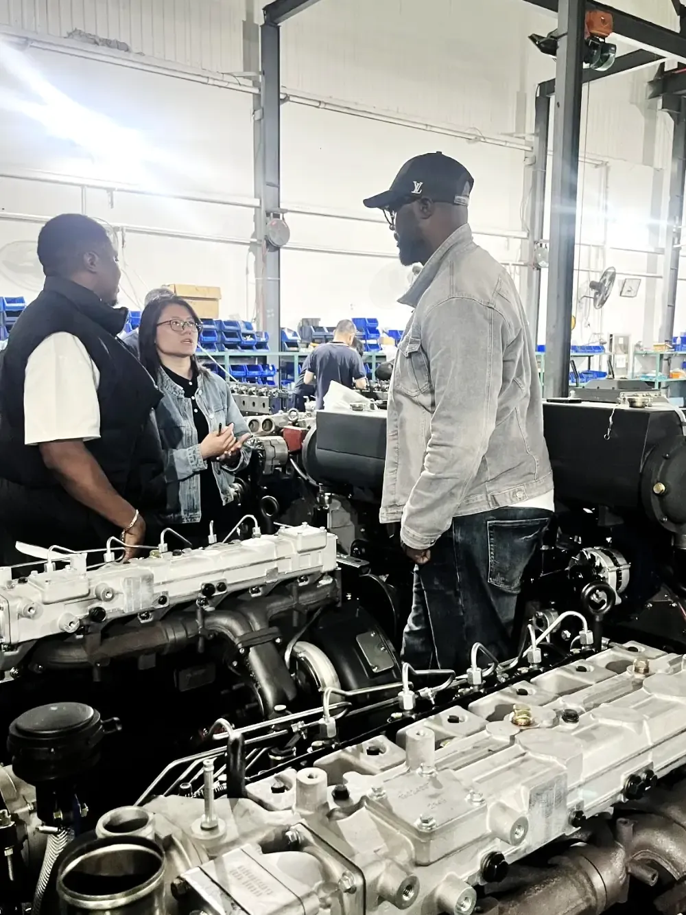 International client touring the generator assembly floor